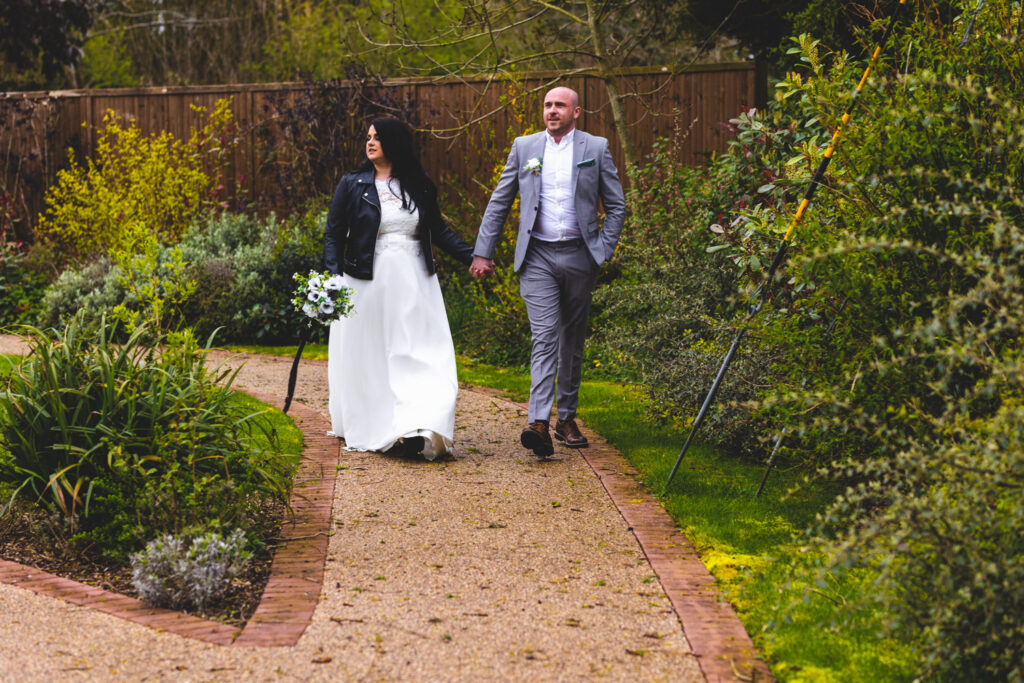 Bride and Groom walking at Hanbury Barns
